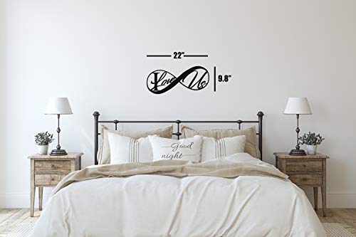 22" sign in black over bed