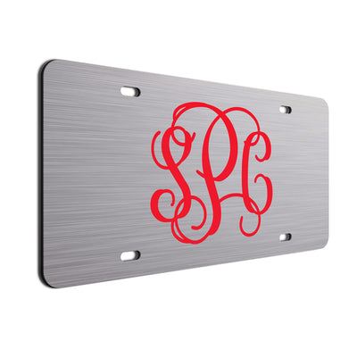Red initials on brushed finish. 