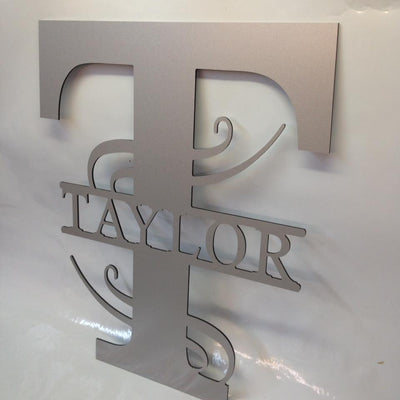 Last Name Taylor sign in silver.
